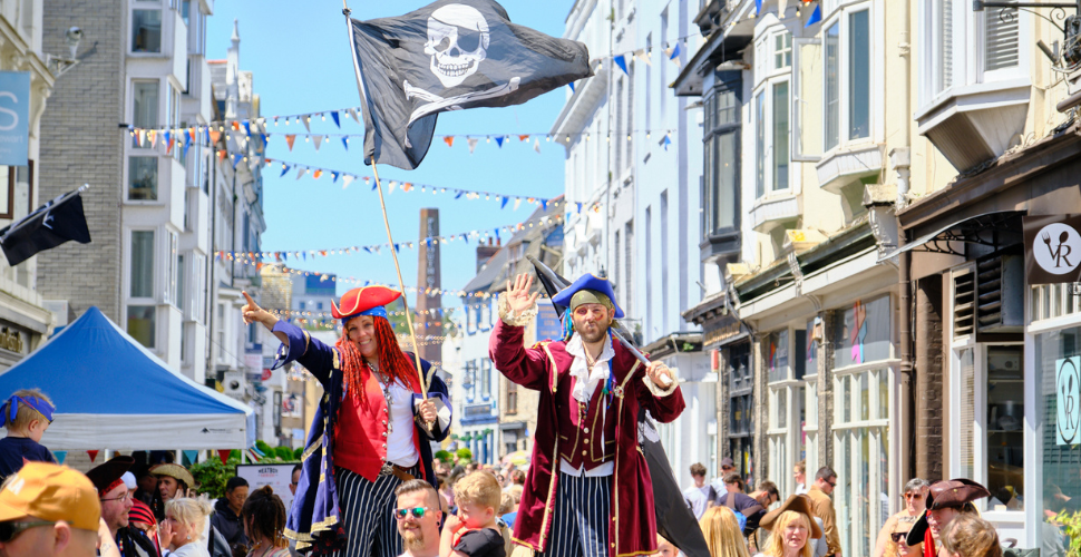 Stiltwalkers and crowds for Pirates Weekend 2024